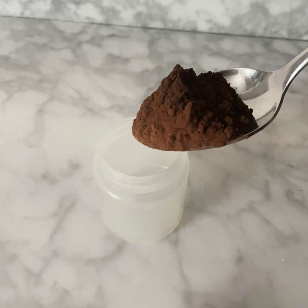 Adding cocoa to make dry shampoo powder. 