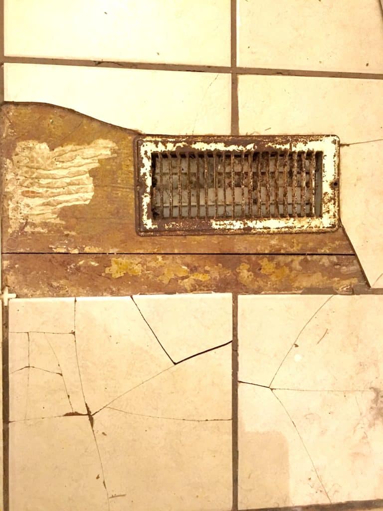 bathroom floor with cracked tile