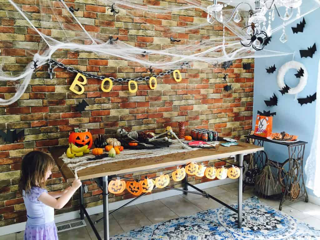 little girl playing at a halloween party