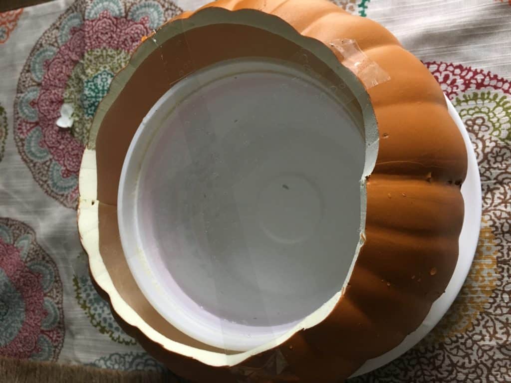 pumpkin vase with smaller container inside to make thanksgiving centerpiece