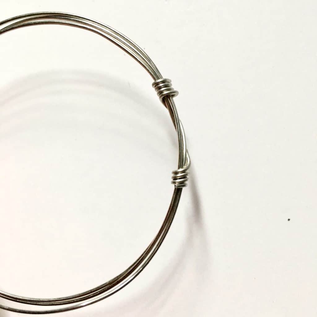 wire wrapped loop with both ends secured around the base