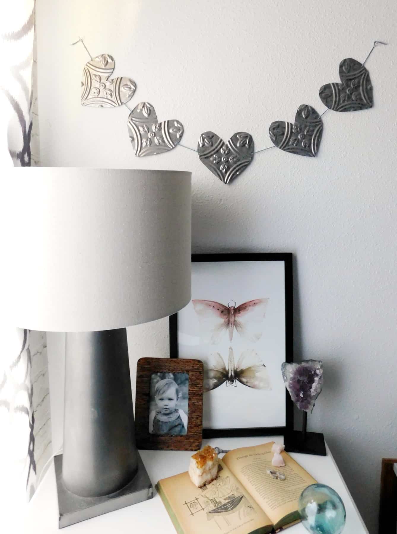 tin wall heart hanging on white wall