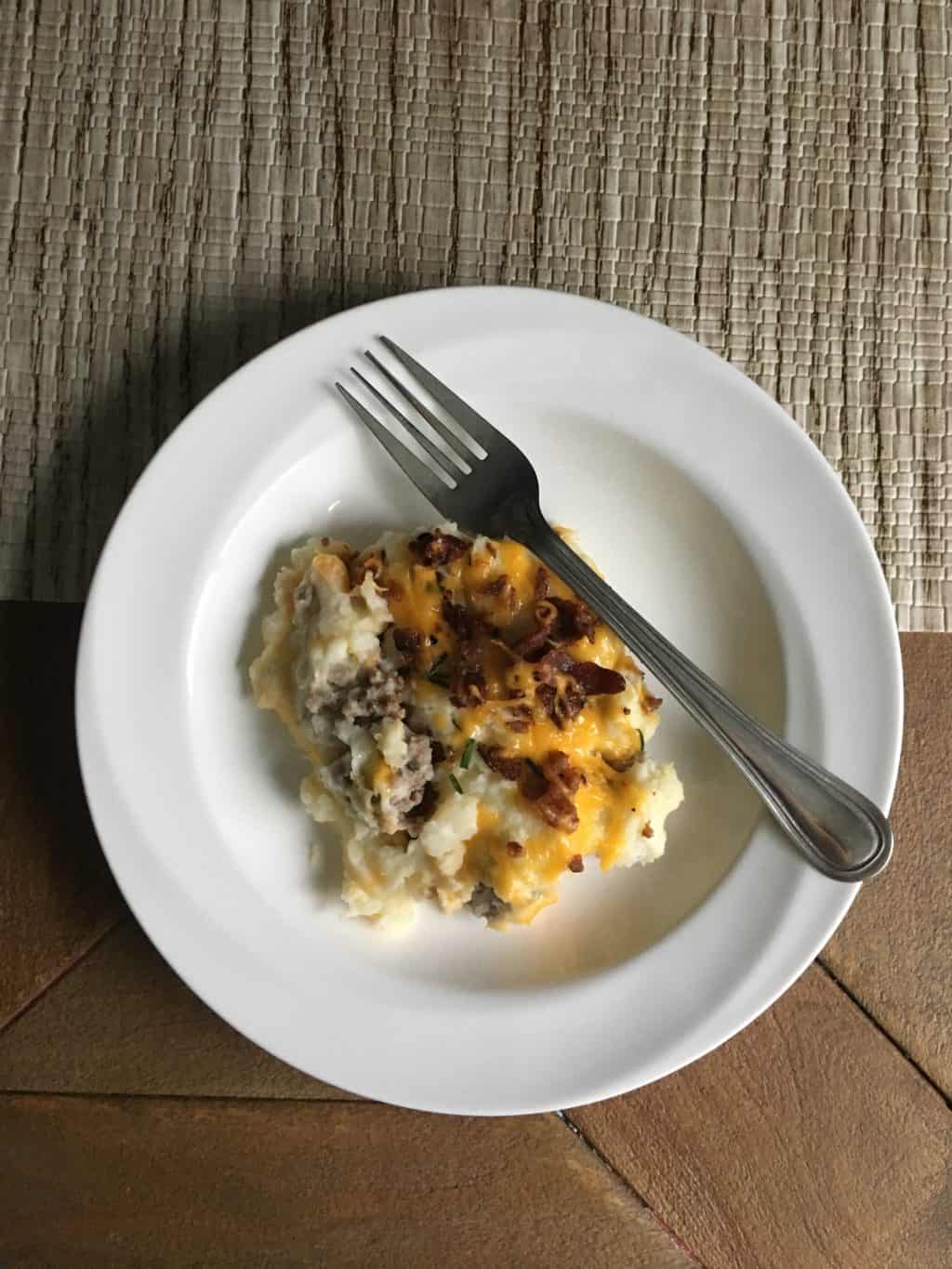 casserole with cheese served on white plate