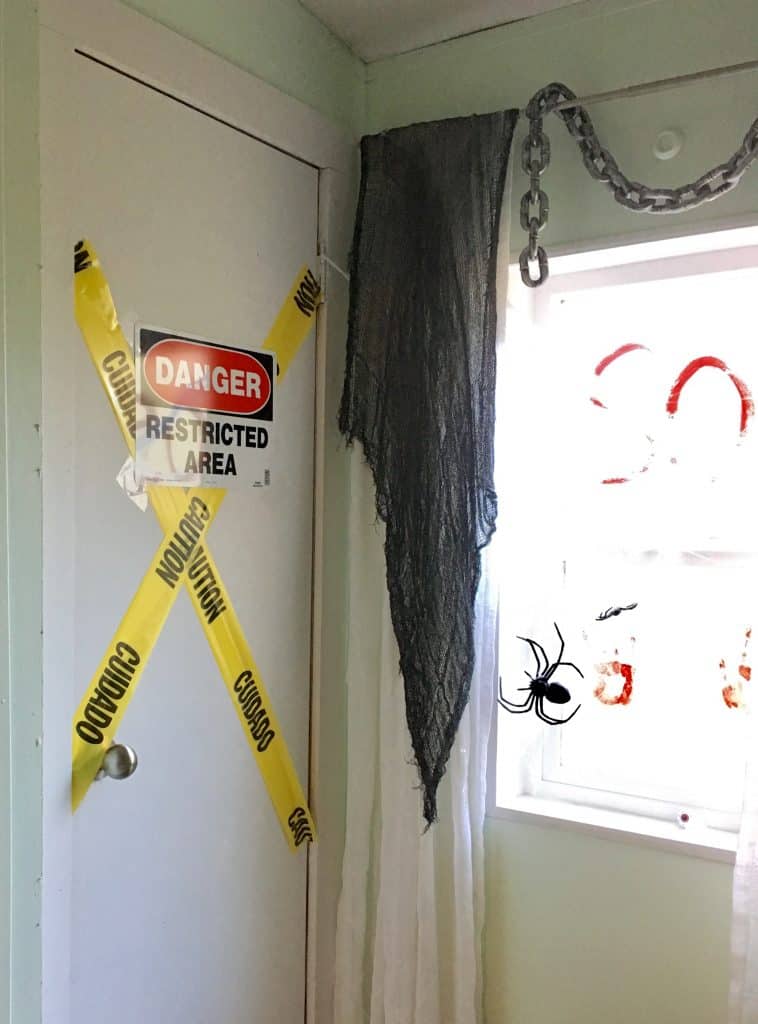caution tape and danger signs up in a bathroom