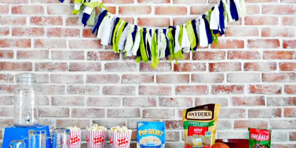fabric banner hanging above the snack table at the football party