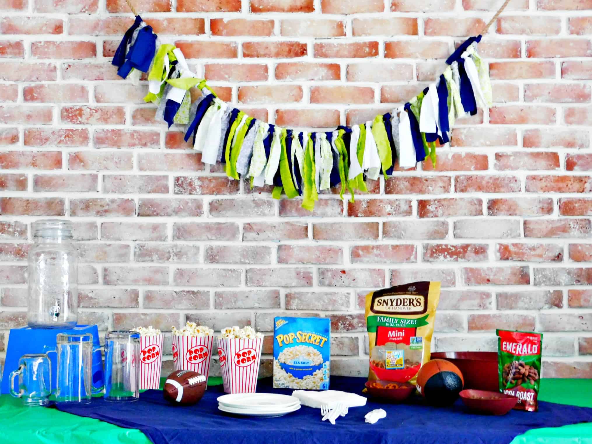 fabric banner hanging above the snack table at the football party