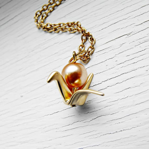Gold paper crane necklace with bronze pearl