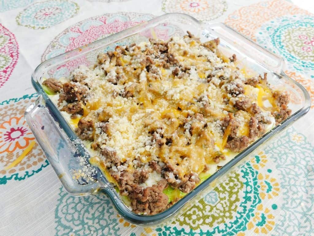 low carb keto lasagna in baking dish on colorful tablecloth