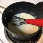 whisking together to get rid of lumps on stove top