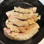 bacon cooking in a skillet