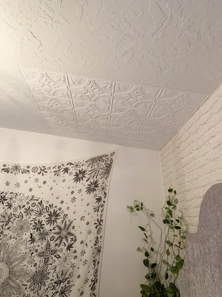 before and after of textured ceiling and ceiling panels