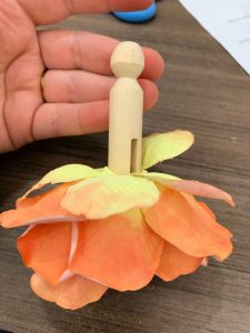 clothes pin with petals on it
