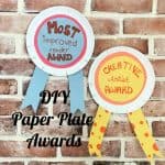 paper plate awards on brick wall