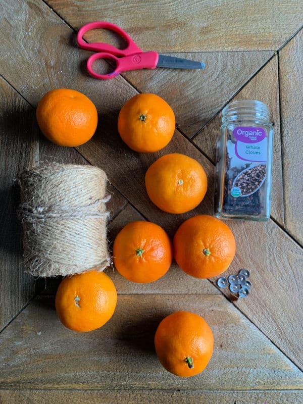 supplies to make a clove studded orange pomander ball