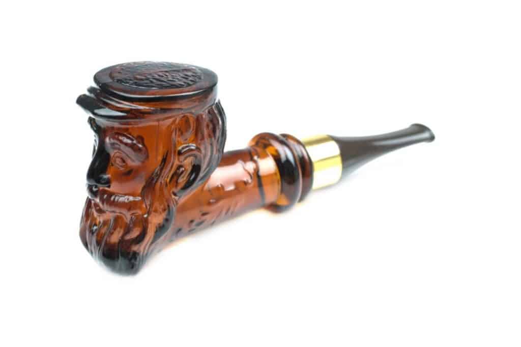 Brown glass pipe shaped like a sailor. 