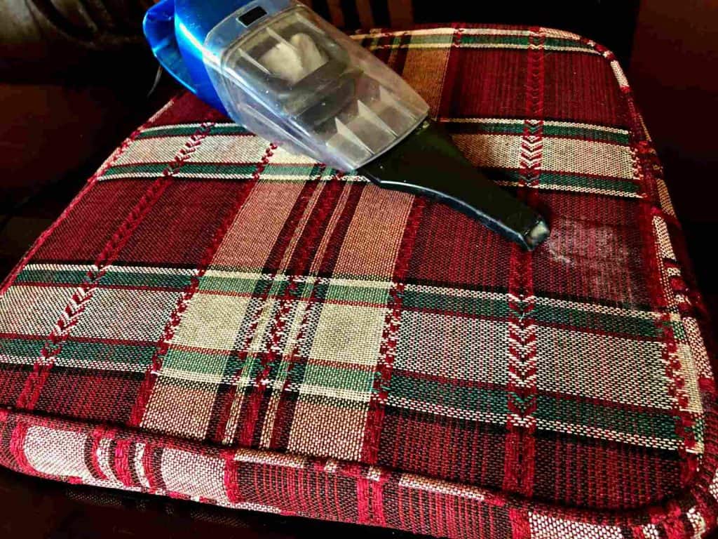 Use vacuum in order clean patio cushions.