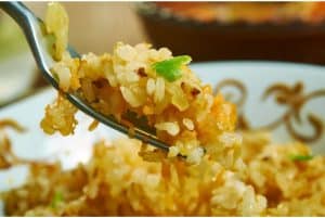 Close up of fried rice on a fork