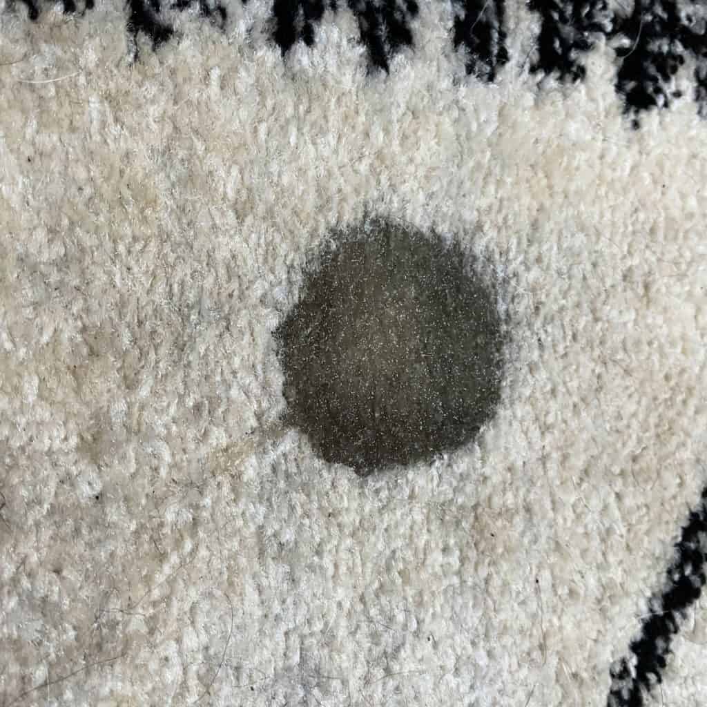 Oil stain on carpet. 