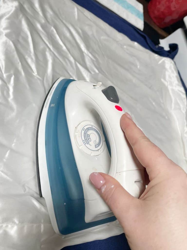 Ironing a silk pillow case.